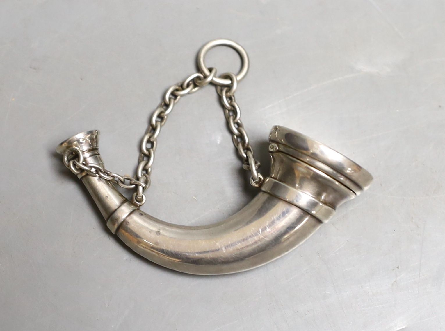 A Victorian novelty silver vinaigrette, modelled as a hunting horn, Sampson Mordan & Co, London, 1873, 76mm.